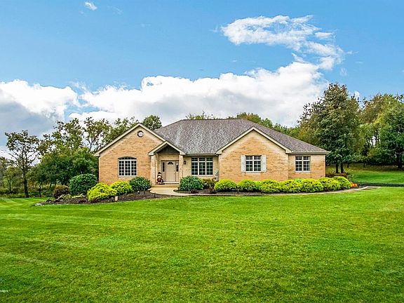 Beautiful brick ranch on 1 acre lot in Hunter's Trail