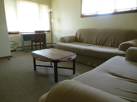 Living room: couch, love seat, coffee table, table with chair