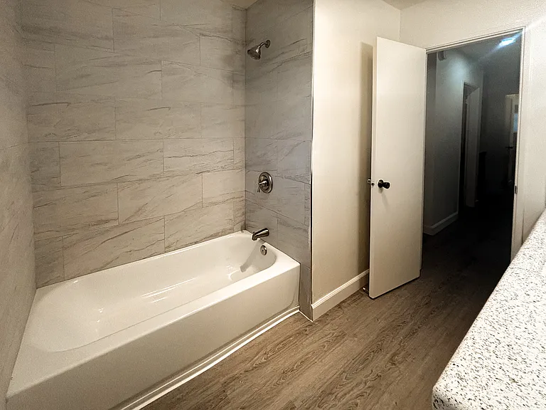 New tub and tub surround in hallway bathroom