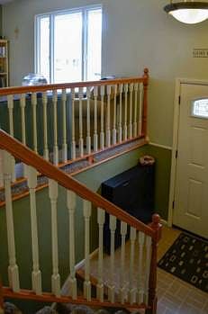 Welcome home!  This custom built banister hand rail features a child proof safety gate.  Two bedrooms on the upper level with the kitchen, living room, dining room and kitchen.  The other two bedrooms, bathroom, and family room are on the lower level.
