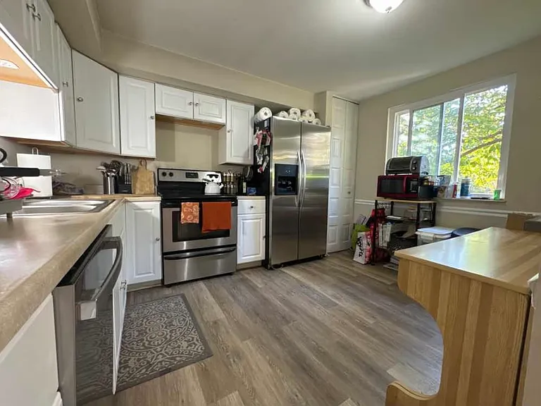 Large open kitchen stainless steel appliances