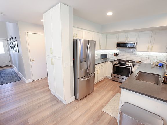 Kitchen remodel with stainless appliances and custom pantry