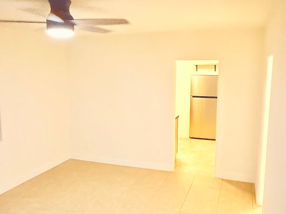 photo from the front door through the living room to the kitchen