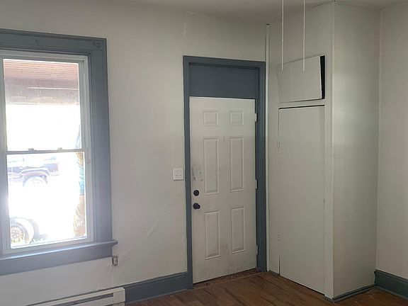 Living area, front door and closet