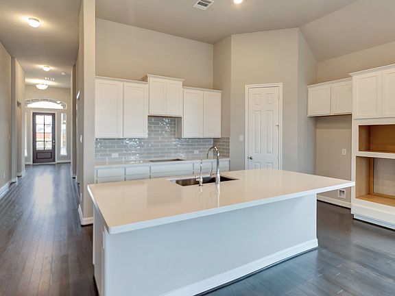 Entryway leading to kitchen and family room