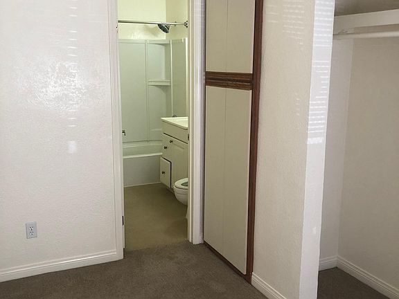 Bedroom looking into bathroom