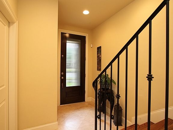 1st Floor - View of Main Front Door and Staircase to second floor.