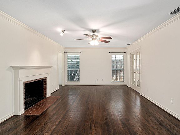 View of Living room from dining room. French doors on the right open to sunroom/office, which leads to large private back yard.