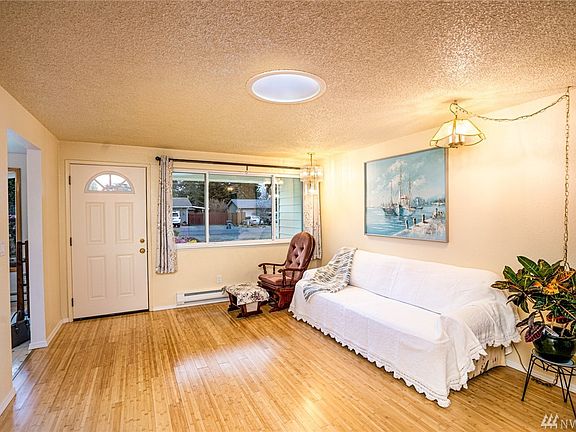 Another view of the living floor and gleaming bamboo floors.  Note the solar tube that provides ample natural lighting. This is one of 4 solar tubes installed in the home. 