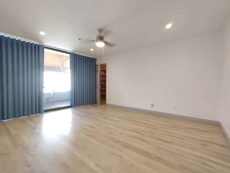 Large master bedroom has 3 closets, ceiling fan and recessed lighting