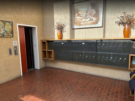 Lobby/Hallway to main Elevator. Elevator is connected to both Pool/Gym/Suana and Common Room