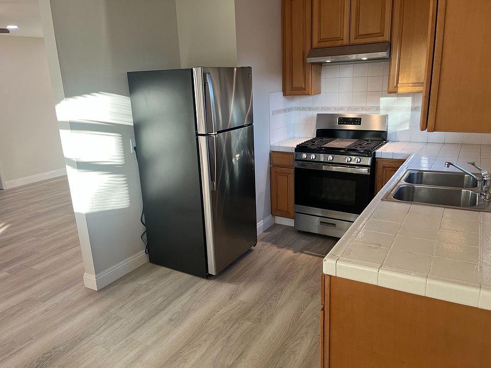 New refrigerator, new stove vent hood, newer gas stove.