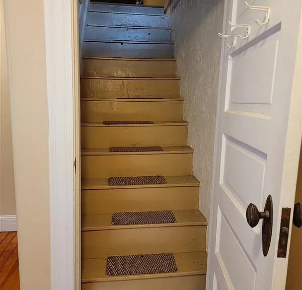 Stairs to walk-up attic storage space