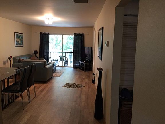 Open living/dining room space. 50" flat screen TV