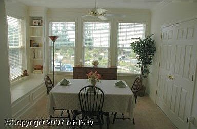 Light-filled sunroom with custom built-in window seat