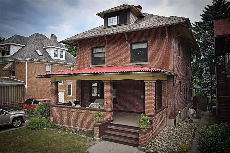 Front of house. Stately, Large all brick 3 story American 4 square architecture in the Craftsman style.  Built approximately 190