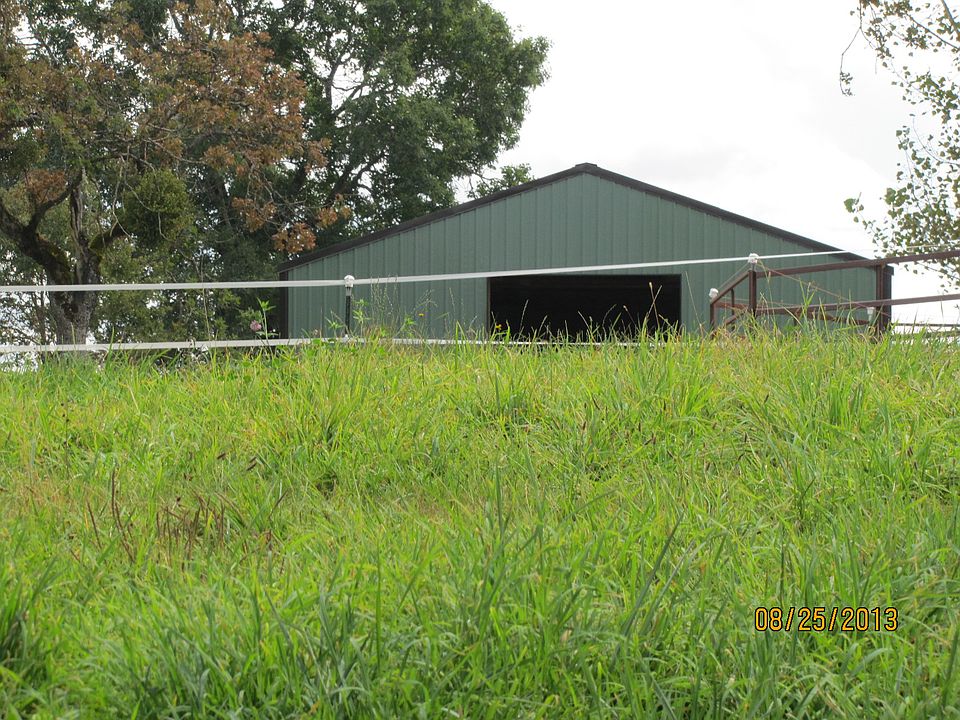 green pastures and hay barn