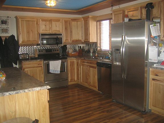 Updated kitchen with stainless steel appliances.