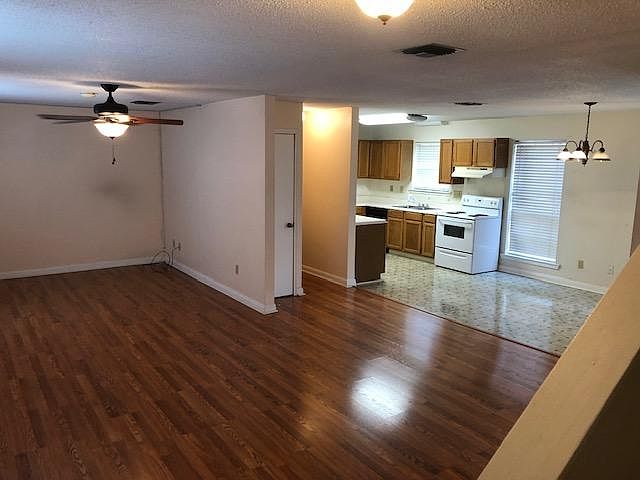 View from Stairs. Very large den area. Open living plan.