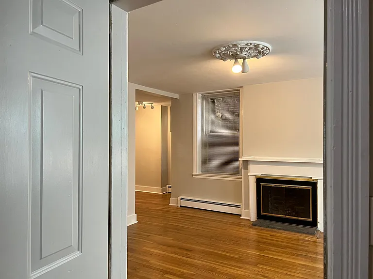 Enter into living room off of interior hallway