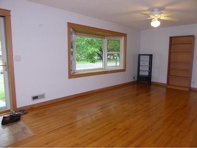 SIMPLE CHIC SPACIOUS LIVINGROOM Views out over the front yard with room off the kitchen for dining.