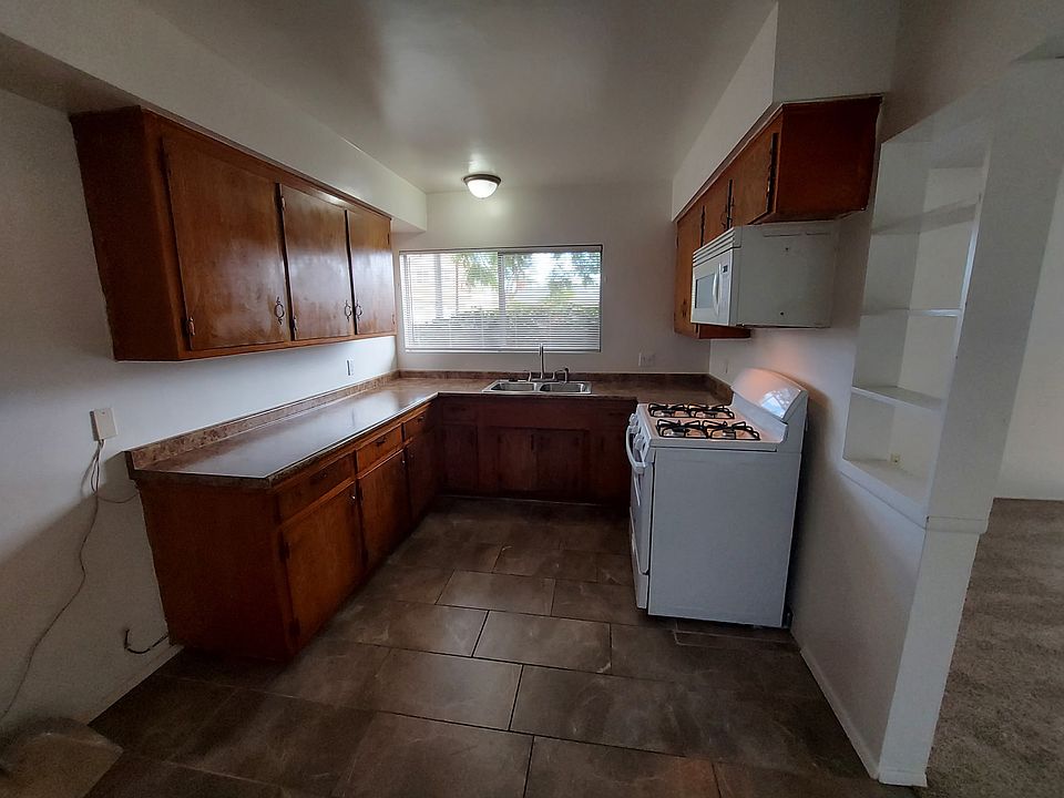 Kitchen New counters, new oven, new stainless steel sink, microwave, new disposal, 24 inch floor tile.