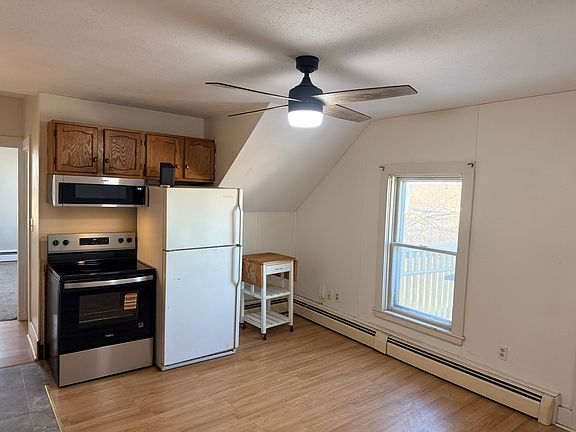 Kitchen with Fridge, stove, and microwave