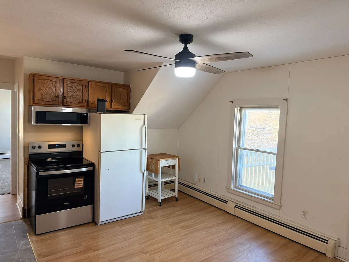 Kitchen with Fridge, stove, and microwave - 130 Central St #2