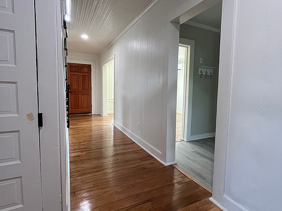 View from Utility Room and Master Bedroom to the hallway and kitchen entrance