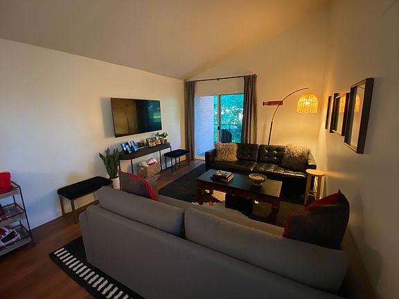 Family room: 55_ TV, plenty of seating. New LVT sliding glass door.
