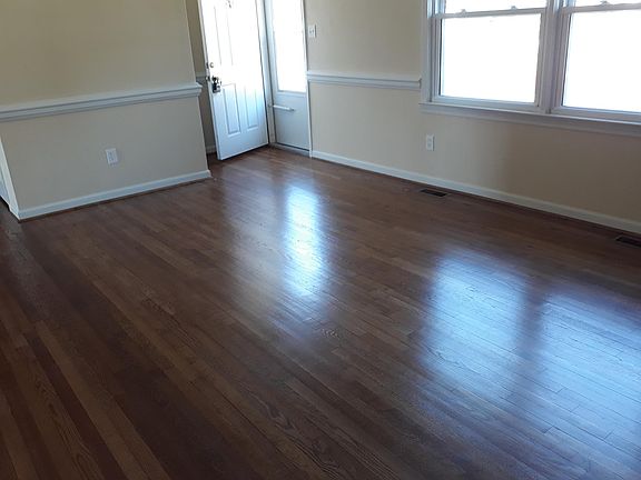 Living room refinished hardwood throughout