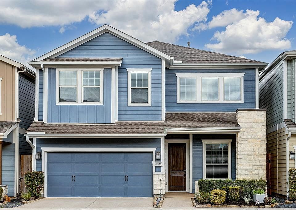 Lovely facade with stone accents and a front porch nook perfect for deliveries!