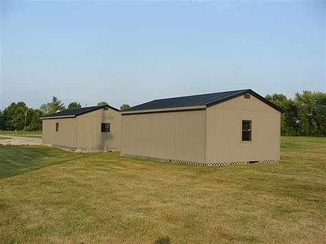 Back and side of the garage and storage building