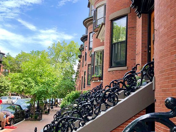 Lovely tree-lined street with brownstones.