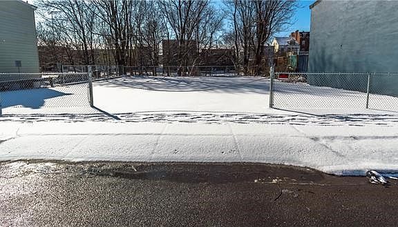 Additional "overflow" parking behind building, adjacent to main parking across Ann Street.