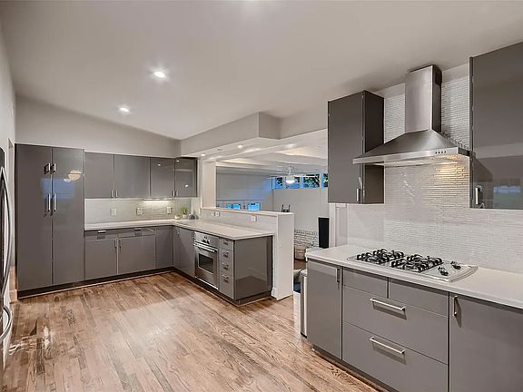 Kitchen with open concept to primary and secondary living areas and eating area.