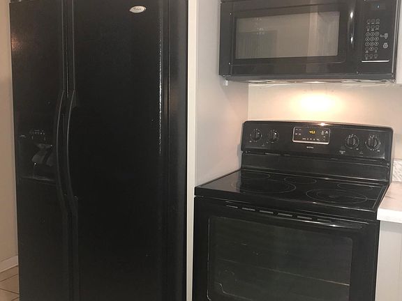 New cabinets and countertops and microwave .