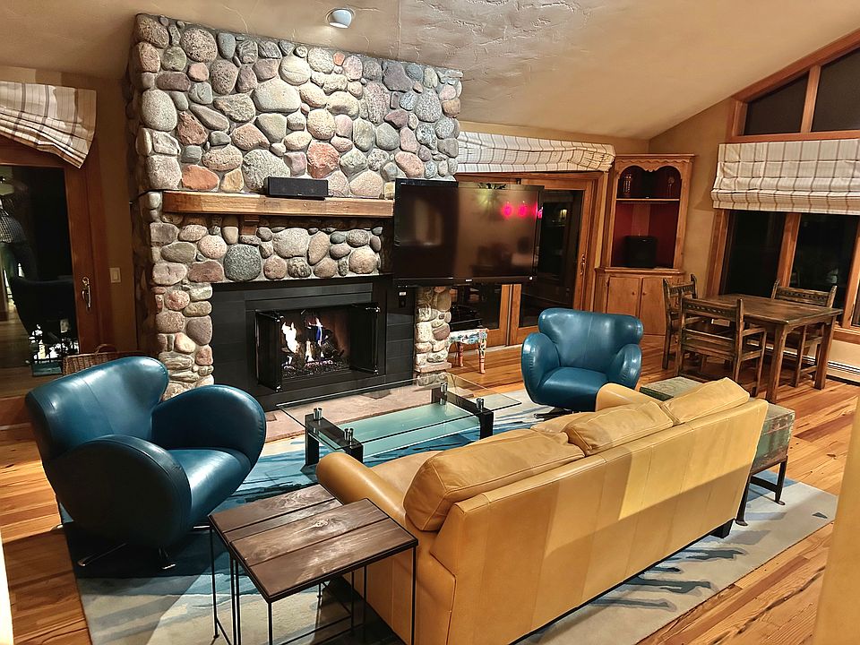 Vaulted ceilings and gas fireplace in spacious living room