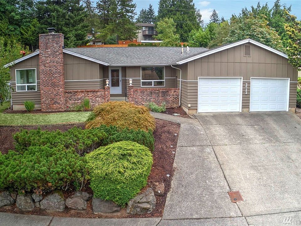 Welcome home to Talbot Hill! This 3 bedroom, 2 bath rambler has been beautifully updated to give it a true northwest feel. This home has a wonderful flow from the elegant entry to the expansive living room and open concept dining room which beckons you in with it's large picture windows and wood-burning fireplace. The sleek, modern kitchen features two tone cabinets, quartz counters, luxury vinyl plank floors, stainless steel appliances, a modern subway tile back splash and a sizable pantry with updated white door. The kitchen is light and bright as it opens to the adjoining family room with breakfast bar. On the way to the tranquil master suite, you will pass two roomy guest bedrooms and a full bath.  