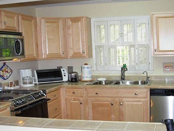 Updated kitchen with stainless steel appliances, tile floor 