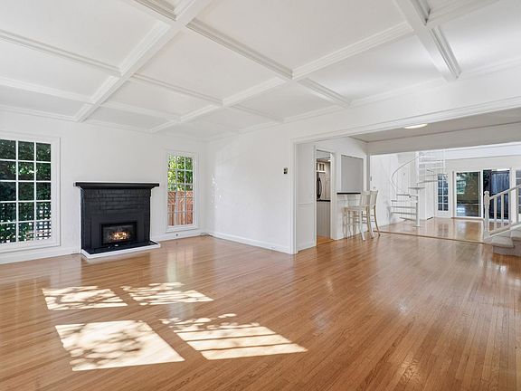 Different POV Living Room w/ fireplace and hardwood floors