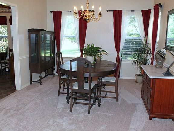 Another look at the Formal Dining Room peeking into the Breakfast area & Kitchen.