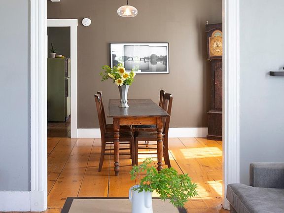 View from bay window in living room toward dining room. Kitchen in background.