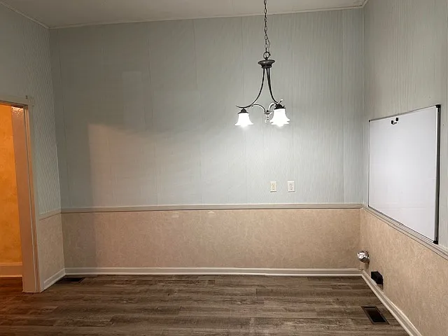 Dine-in space in kitchen with white board organizer