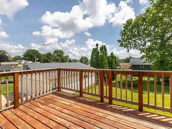 Fenced in backyard below deck.