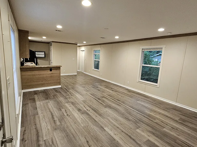 Spacious living room area, with breakfast bar at the kitchen.
Brand new laminate floor throughout the house!!
