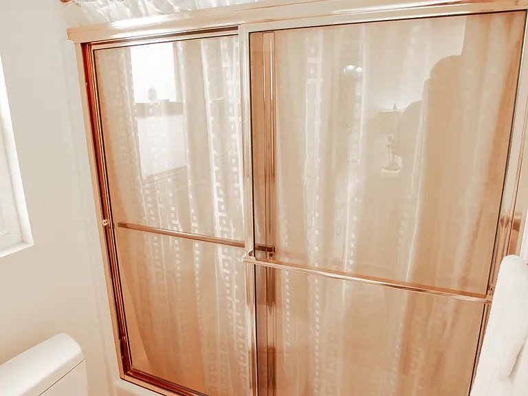 Shower, shower and tub in primary bathroom