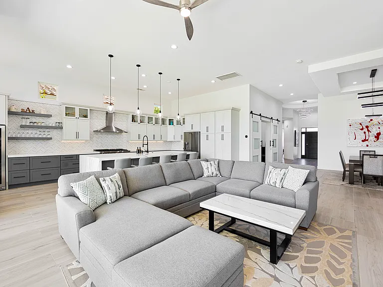 The expansive living room features a comfortable couch sure to reel everyone for cozy movie nights.