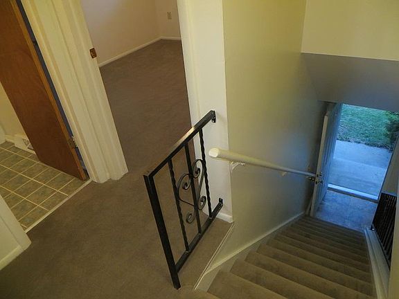 From 2nd floor landing, entrance to main bath, front bedroom and down stairs towards front door. Back bedroom is behind camera.