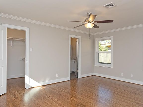 Great master bedroom with 3 windows,  2 closets, beautiful hardwoods, and crown molding.